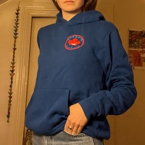 Blue hoodie with red canadian emblem